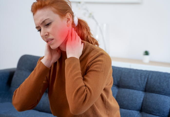 Woman with fibromyalgia touching her neck